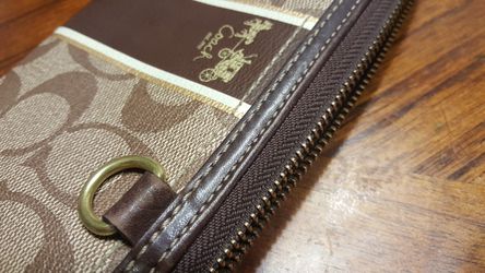 COACH Accordion Zip Wallet In Signature Coated Canvas With Leather Stripe