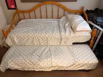 Wooden twin trundle bed with mattresses