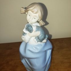 NAO by Lladro-
Girl Holding Puppy Porcelain Figurine- 
DAISA 1987