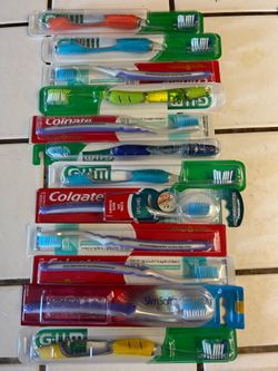 Toothbrushes new  sealed 12 total