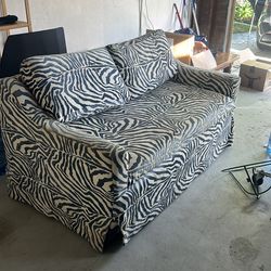 Blue and white printed sofa with ottoman