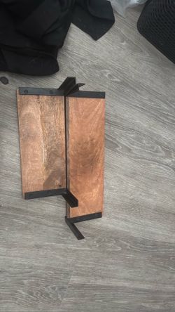 matching pair of wooden wall-mounted shelves/racks with black metal hardware