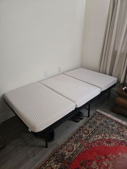 Two sided milliard mattress Firm/Soft Twin size mattress and frame. Like New.
