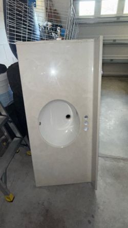 Bathroom vanity top with integrated sink