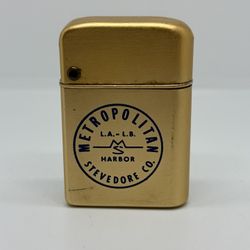 Vintage Storm Master Gold Tone Advertising Lighter "Metropolitan Stevedore Co"