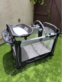 Pack and Play w/ Bassinet, Changing Table, & Storage - Graco, music