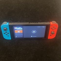 Nintendo Switch Console with Neon Blue / Red Joy-Cons HAC-001 + Generic Charging Cord. 