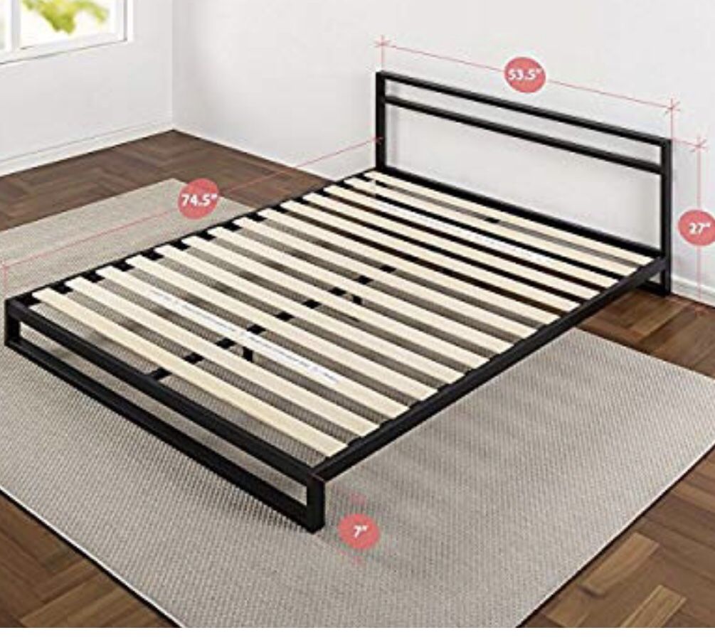 Black metal framed full size bed