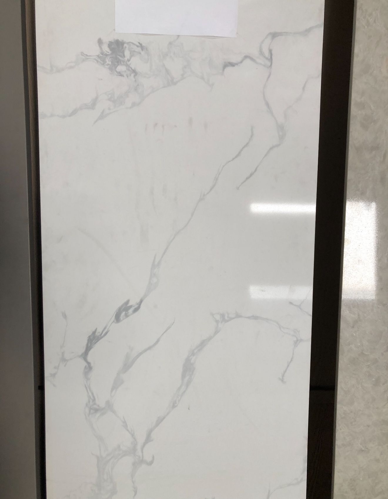 Delicatto Carrara Polished Quartz Slab • 27.75” x 116” • Bedrosians Stone