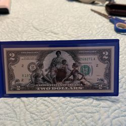 $2 // Dólar Conmemorativo