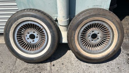Two Lincoln Continental Or Mark V turbine style chromed aluminum 15 Inch wheels with old tires 5 On 5 Lug pattern