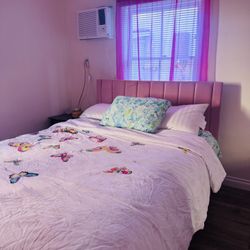 Upholstered Platform Bed with Pink Velvet and Striped Headboard