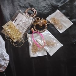 Three Packs Of Pretty Golden Rings Three Bracelets Two Packs Of Silver And Gold Earring