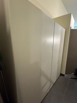 Two white Ikea Closet