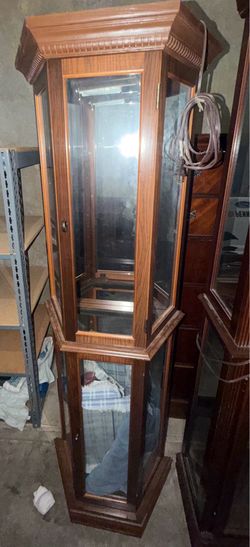 Pulaski wood-framed glass curio cabinet