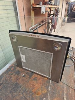 Over the stove exhaust fan, convertible glass
