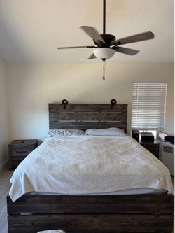 Cal king bed with nightstands and dresser with mirror