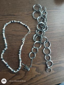 Assorted jewelry: two nice chains / necklaces, three pairs of pierced earrings, one blingy slap-on watch