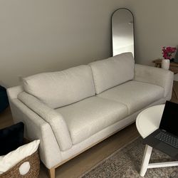 Elegant Modern Style Sofa with Oakwood bottom and legs.