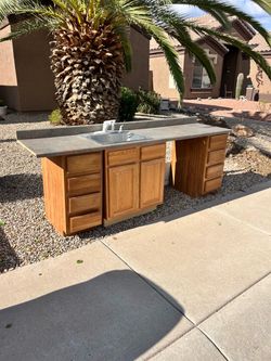 Free sink cabinet with 2 four drawer cabinets.