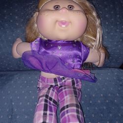 Cabbage Patch Kids doll blonde hair purple outfit
