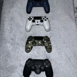 Four Used PS4 Remotes