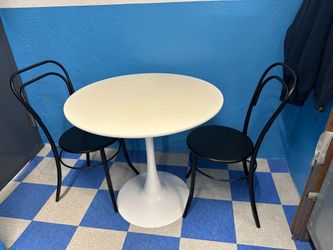 2 Chairs & White Table