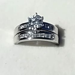 Authentic sterling silver wedding and engagement ring set.  