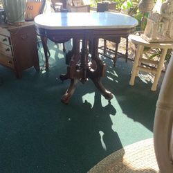 Marble Top antique table on Wheels 