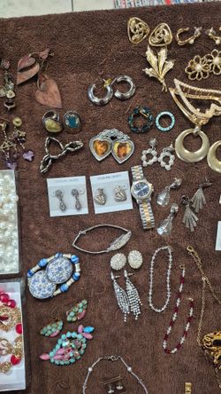 Some earrings , and 2 watches and some Costume jewelry