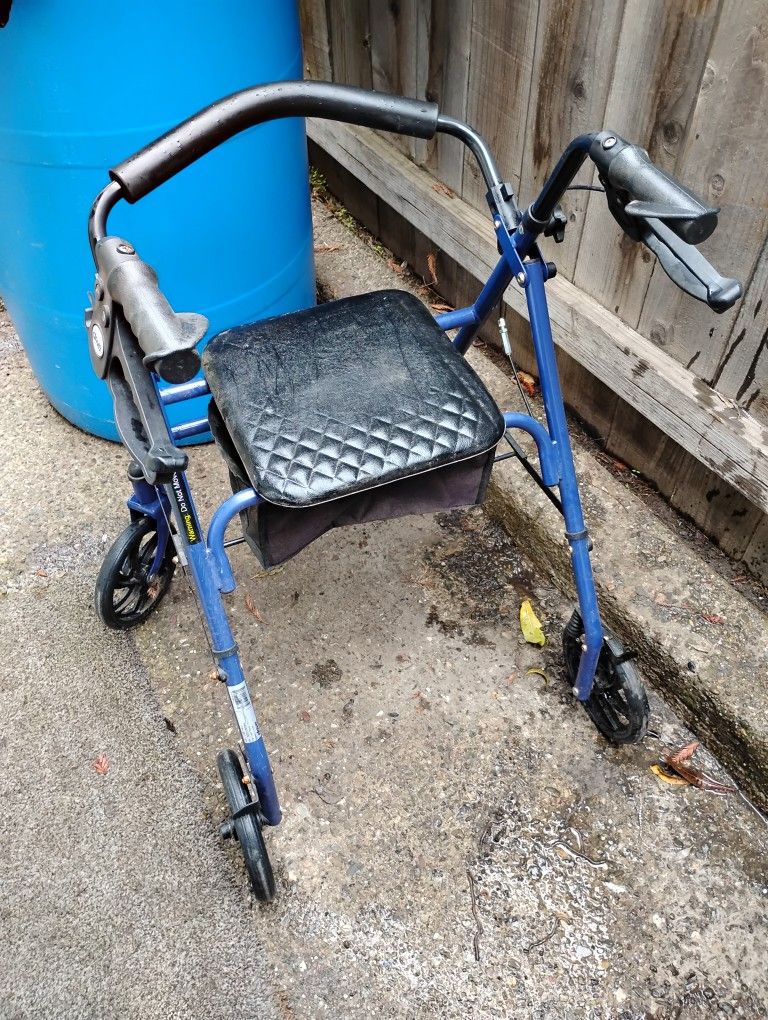 Walking Chair With Seat 20.00 new But Left Outside One Night