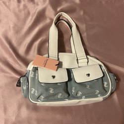 Juicy Couture Pack It Up Bowler Bag in light washed denim with white faux leather