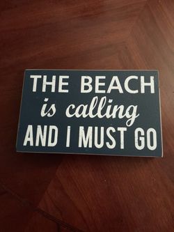 "The Beach is Calling and I Must Go" sign


