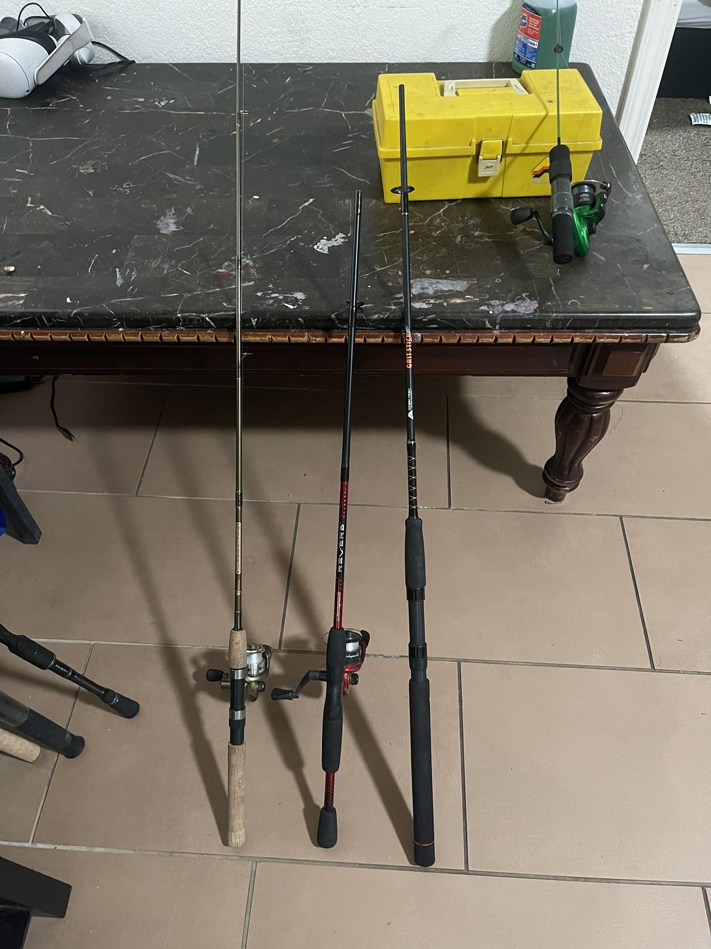 Three Fishing Poles And Reels