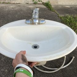 White Oval Sink With Faucet & Water Hoses 
