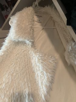 White fur vest