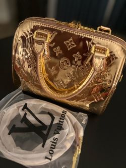 Rose gold Louis Vuitton bag