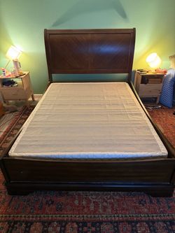 Dark Wood Sleigh Bed Frame Queen & Red Rug