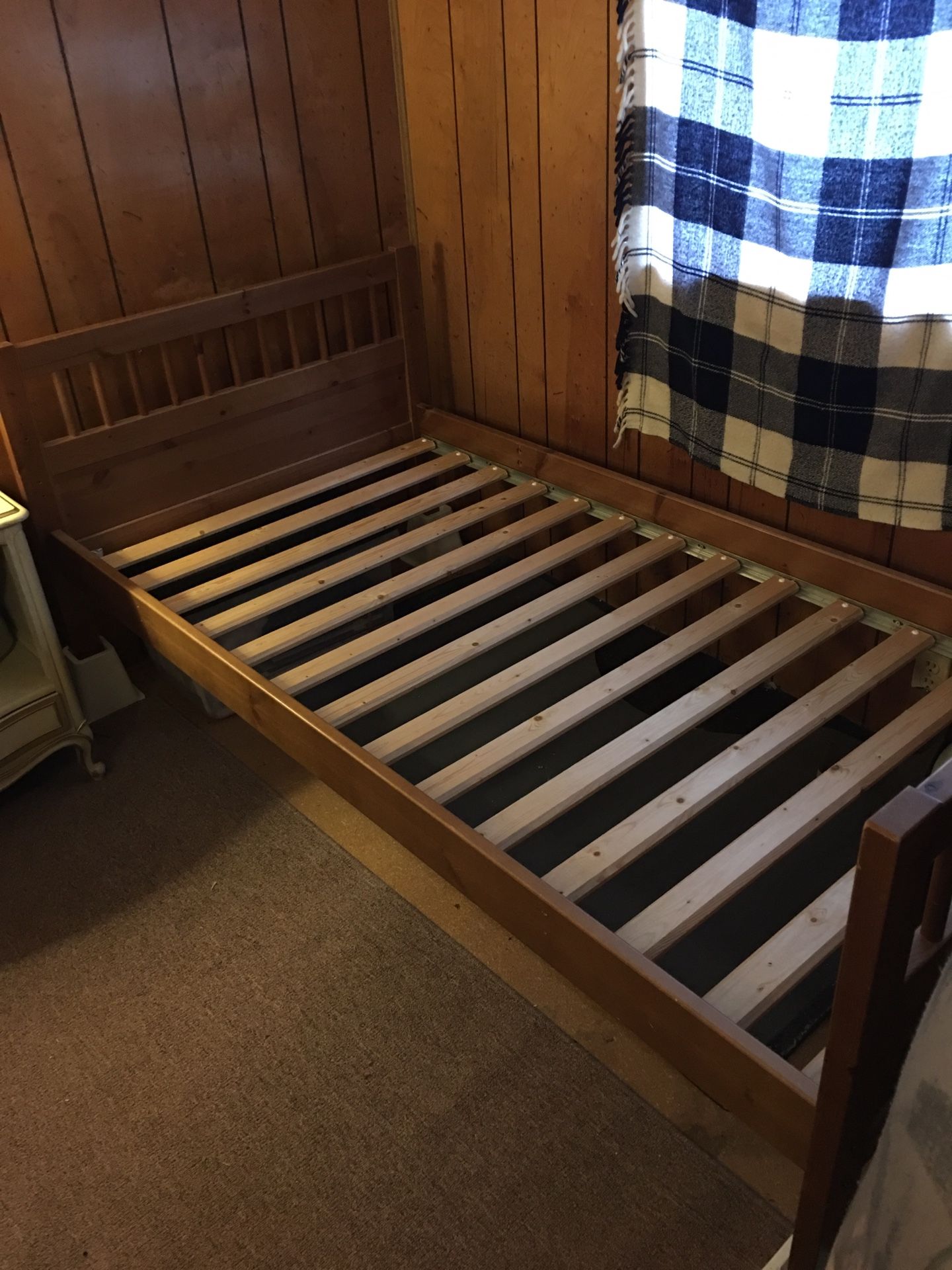 Regular, wood twin bed.