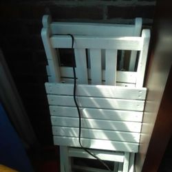2 White wooden folding chairs