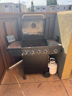 Nexgrill 4-Burner Propane Gas Grill with propane tank