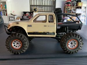 Photo Axial Scx10.2 with custom billet beadlocks and mud tires