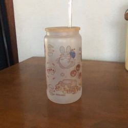 frosted glass tumbler with a bamboo lid and a reusable straw, featuring illustrations inspired by Studio Ghibli characters. The artwork is by Peony Le