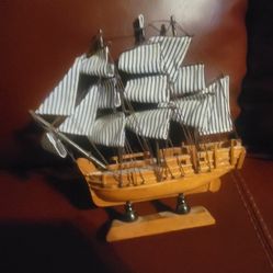 wooden model ship, likely a replica of the HMS Bounty