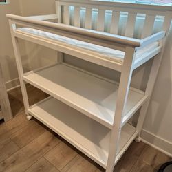 Delta Children Changing Table with Wheels and Changing Pad