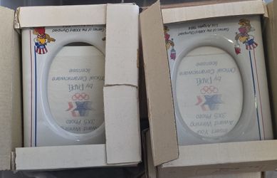 These are vintage 1984 Los Angeles Olympic ceramic picture frames designed to hold a \(3 \times 5\) photo.