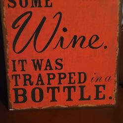 Metal Sign. humorous sign that reads: "I JUST RESCUED SOME Wine. IT WAS TRAPPED in a BOTTLE." 