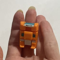 Transformers BotBots Series 1 Sticky McGee figure, which is a collectible tape dispenser toy. 