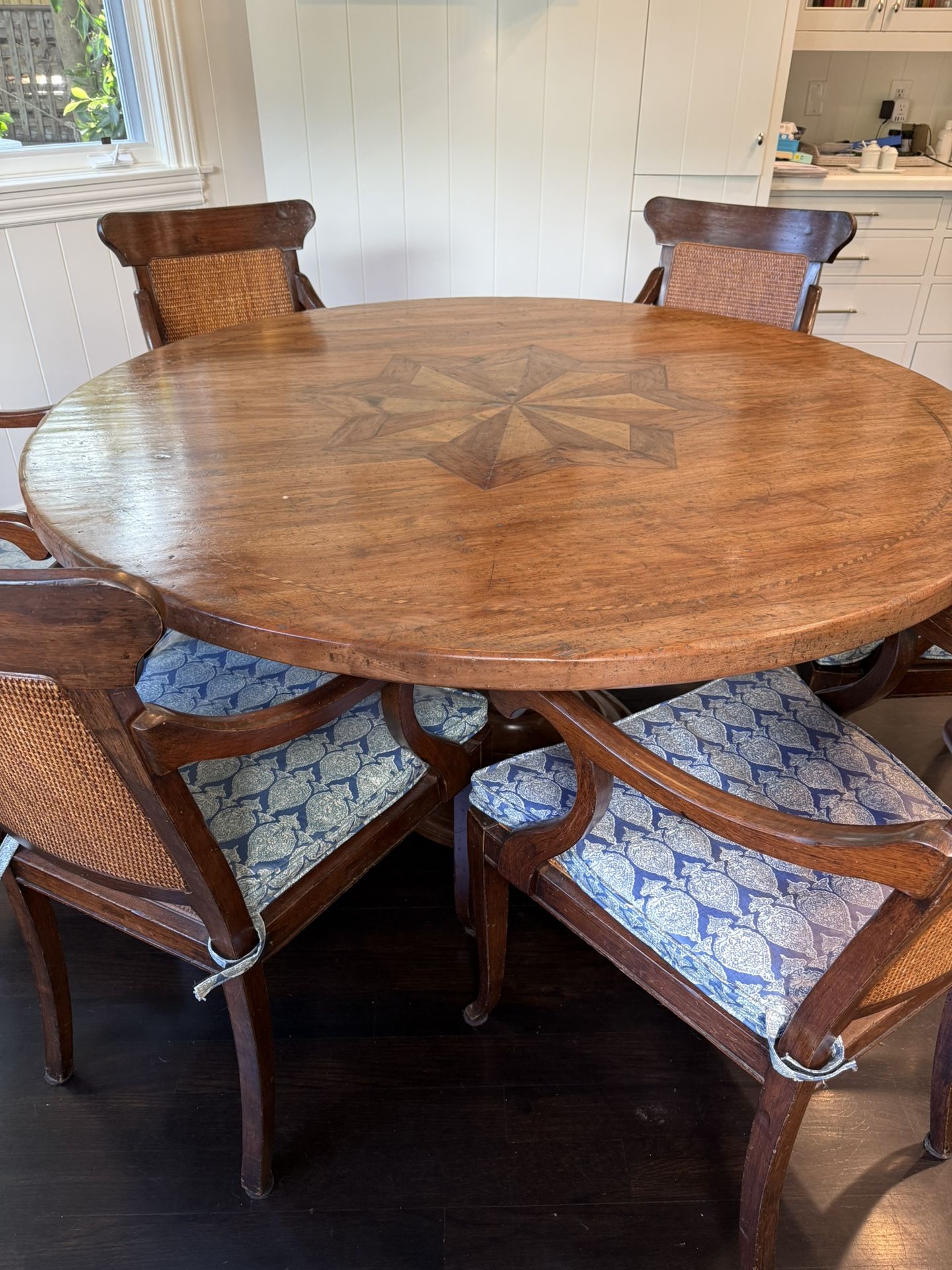 Gorgeous round Indonesian hardwood with in-lay dining table with 6 wood and cane chairs