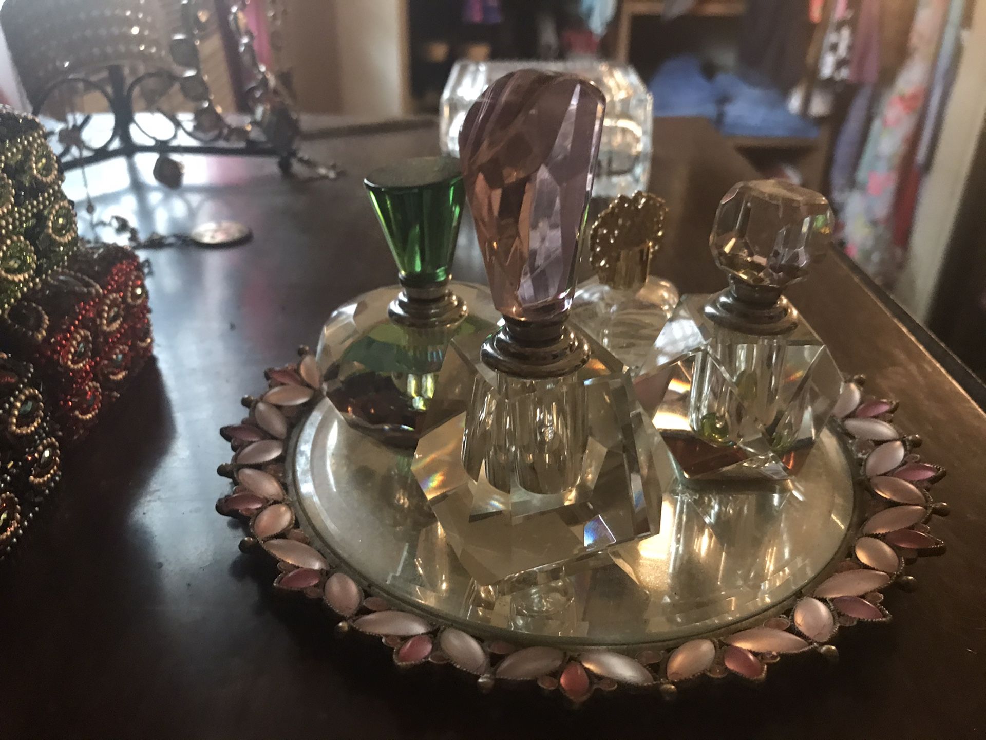 Antique style perfume bottles on glass plate